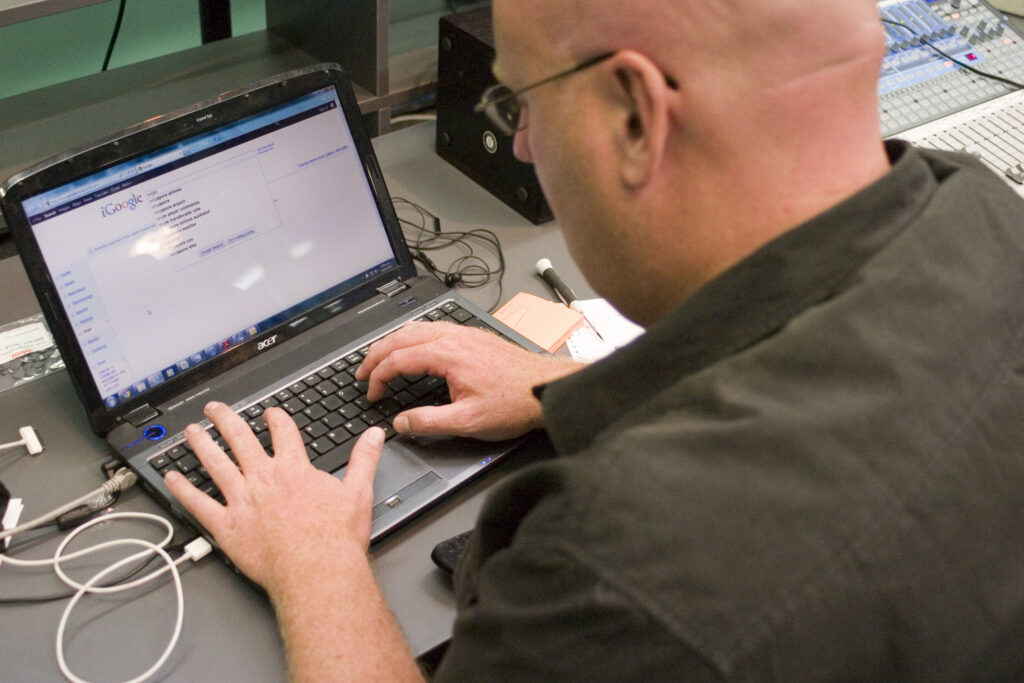 Laptop showing Google Search while researching image SEO best practices